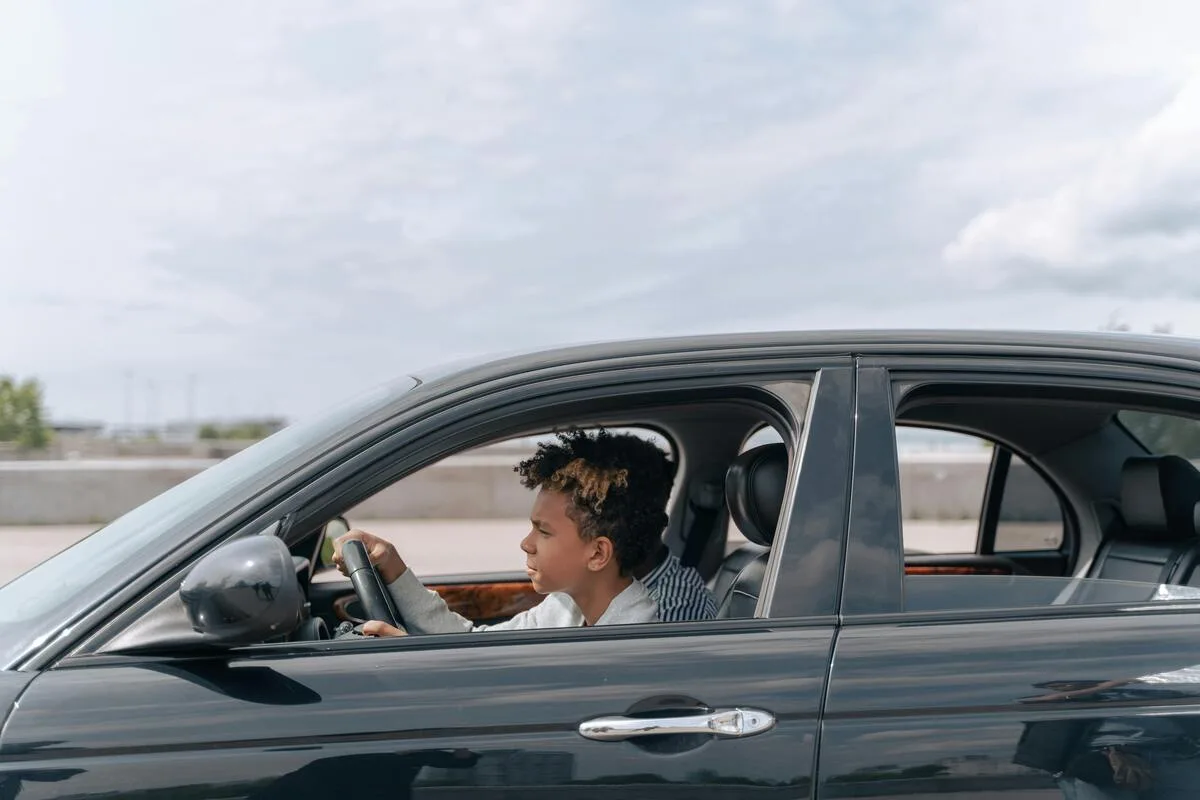 Student driver gripping the steering wheel during their first road lesson